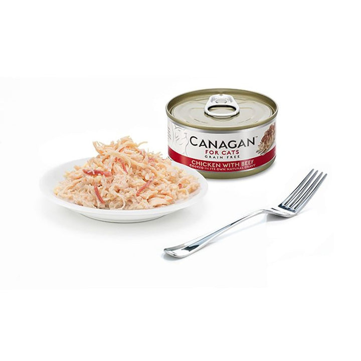 Canagan Chicken with Beef served on a plate beside the can, shredded chicken with strips of beef in its own gravy