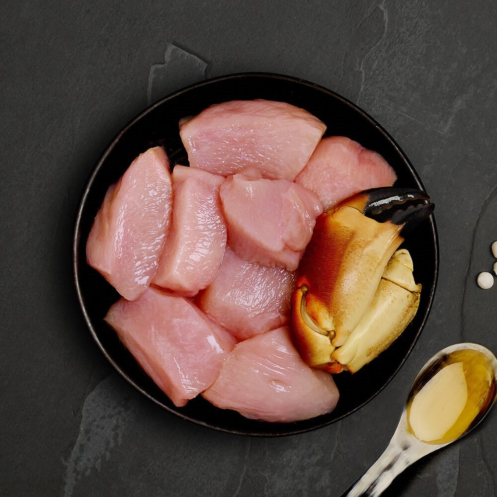 Fresh chicken and a crab claw, the ingredients in Canagan Chicken with Crab for cats