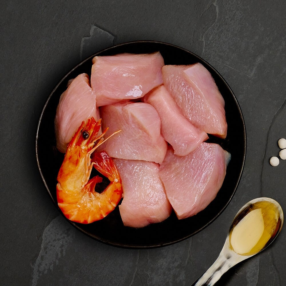 Fresh chicken and a whole prawn, the ingredients in Canagan Chicken with Prawns for cats