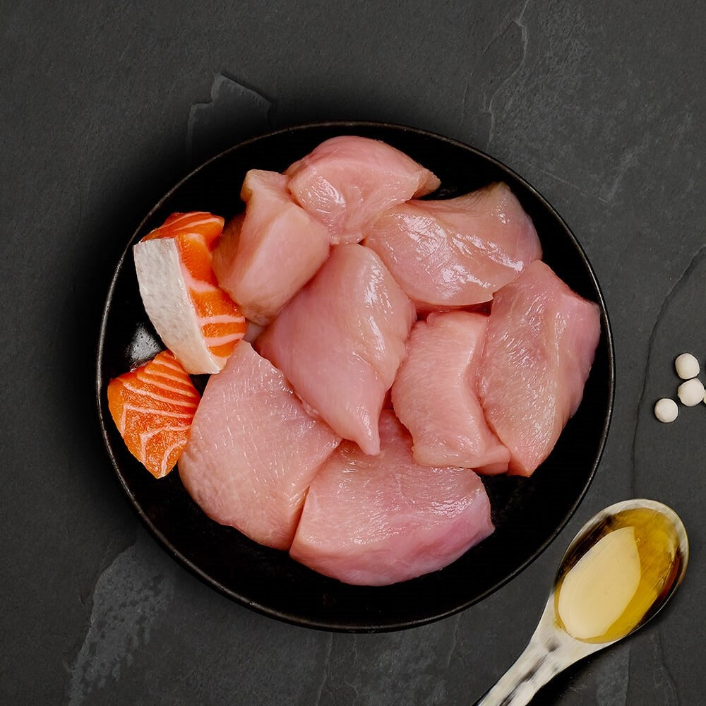 Fresh chicken and salmon, the ingredients in Canagan Chicken with Salmon for cats
