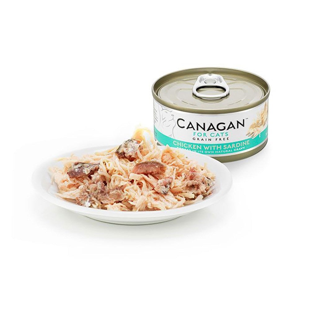 Canagan Chicken with Sardine served on a plate beside the can, shredded chicken with pieces of sardine in its own gravy