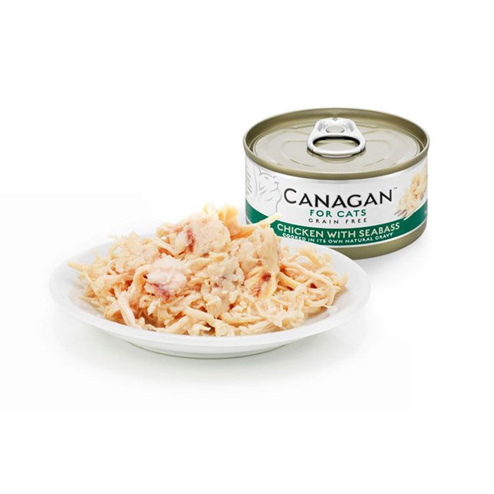Canagan Chicken with Seabass served on a plate beside the can, shredded chicken with flakes of seabass in its own gravy