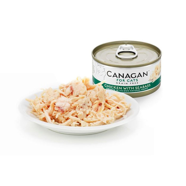 Canagan Chicken with Seabass served on a plate beside the can, shredded chicken with flakes of seabass in its own gravy