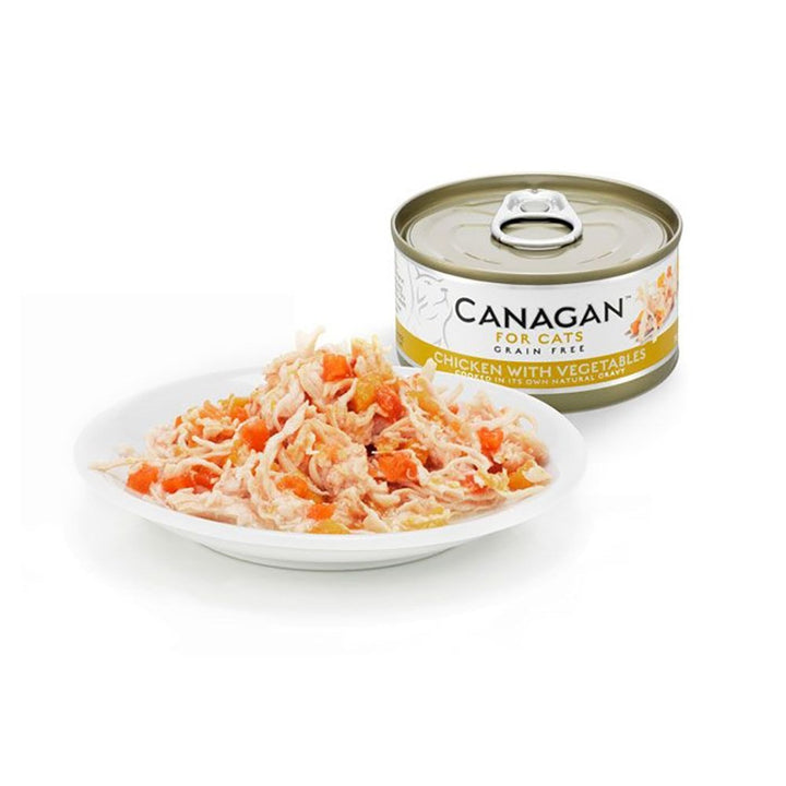 Canagan Chicken with Vegetables served on a plate beside the can, shredded chicken with carrot and pumpkin in its own gravy