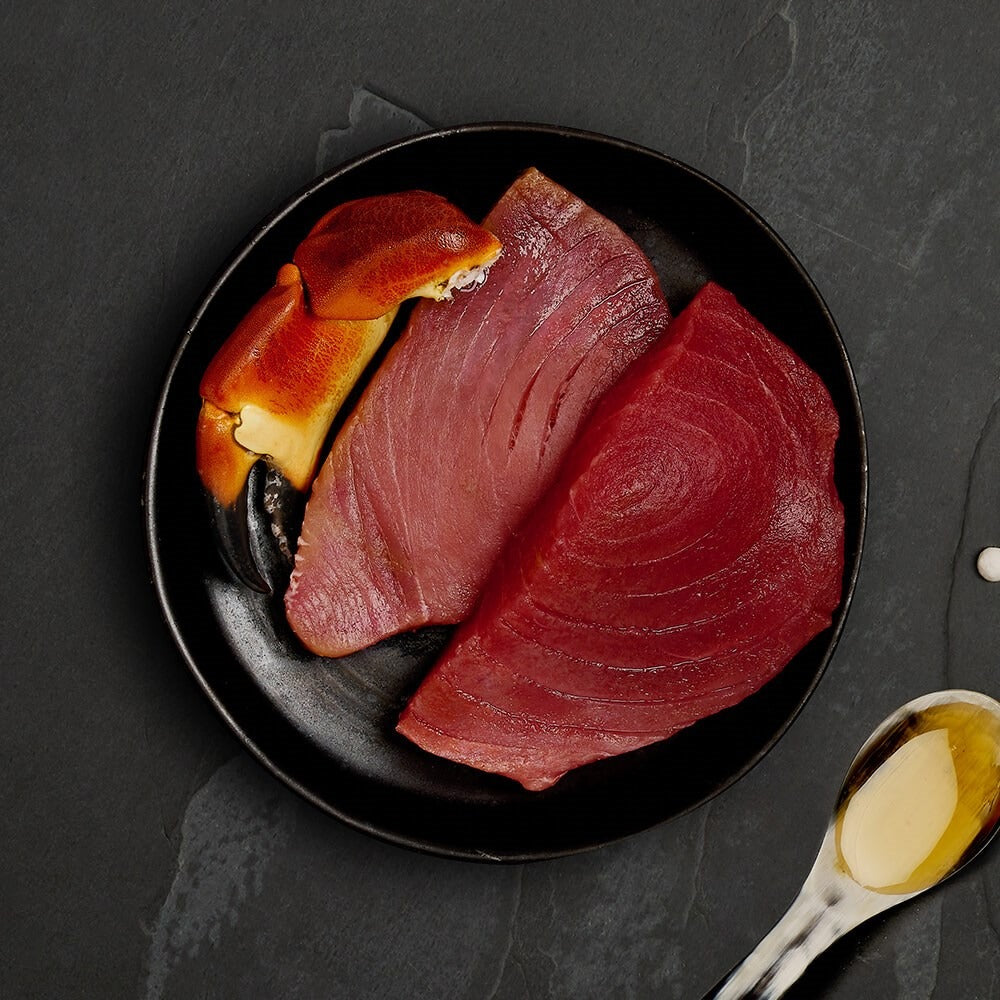 Fresh tuna steaks and a crab claw, the ingredients in Canagan Tuna with Crab for cats