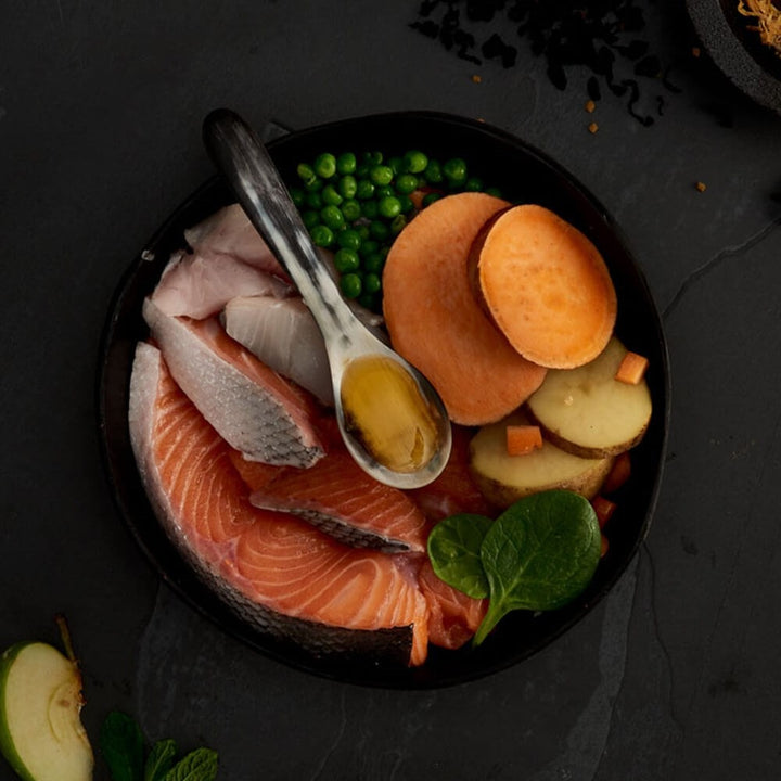 Fresh salmon, white fish, sweet potato, peas and potato, the ingredients in Canagan Small Breed Scottish Salmon